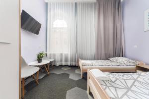 Postel nebo postele na pokoji v ubytování Moon Hostel Warszawa