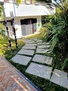 a stone walkway in front of a house at Casa di Giove room in Pompei