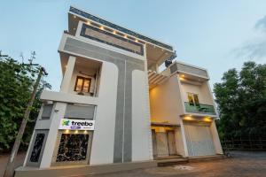 a building with a sign on the front of it at Treebo Tryst Villa Escape In With Pool View in Auroville