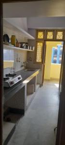 a kitchen with a counter and a sink at Al Amoodi Furnished Apartments in Hyderabad