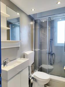 a bathroom with a toilet and a sink and a shower at KYMA Apartments - Athens Acropolis 1 in Athens