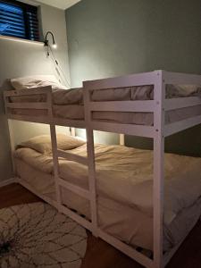 a white bunk bed in a room at Villa Park in Bennebroek