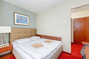 Posteľ alebo postele v izbe v ubytovaní Gryf Resort Międzywodzie