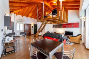 a living room with a table and a loft at Casa Roncati by Wonderful Italy in Bellagio