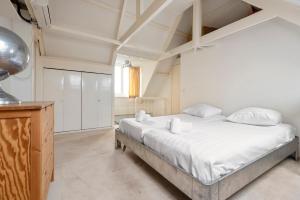 Postel nebo postele na pokoji v ubytování Zandvoort Zenith - Beautiful Apartment