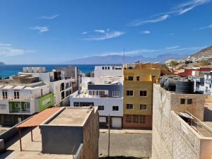 a view of a city with buildings and the ocean at Apartamentos Beira-Mar in Mindelo