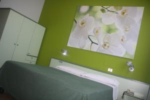 Postel nebo postele na pokoji v ubytování Hotel Valbrenta