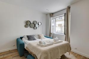 Кровать или кровати в номере 152 Suite Sylvie - Superb apartment in Paris