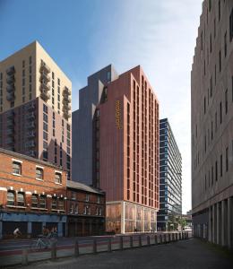 a group of tall buildings in a city at Maldron Hotel Manchester Cathedral Quarter in Manchester