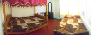 - une chambre avec 2 lits superposés dans l'établissement Lions Villa & Resort, à Deniyaya