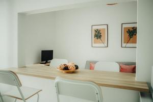 a dining room with a table and chairs at Belém Tejo - Memória by Local in Lisbon