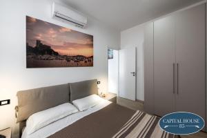 Posteľ alebo postele v izbe v ubytovaní Capital house 85
