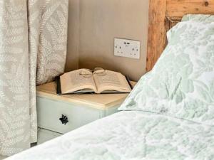 Voodi või voodid majutusasutuse Ingleside Cottage toas