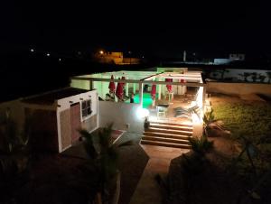una vista aerea di una casa di notte di Riad Ocean Beach Douira ad Agadir