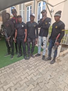 a group of men standing in front of a house at STAR DIAMOND VIEW LOUNGE & SUITE 