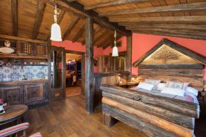 a bedroom with a large wooden bed in a room at Prada a Tope - Palacio de Canedo in Canedo