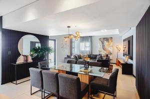 a living room with a table and a couch at CAG The Vantage Rosebank in Johannesburg +91 photos
