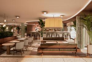 a lobby with tables and chairs and a bar at Hotel Bahia del Sol in Santa Ponsa