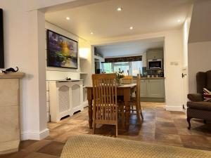 a kitchen and dining room with a table and chairs at Number Five Sheep Street in Chipping Campden