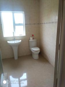 a bathroom with a toilet and a sink at 3/45 Oxley Road in Port Edward +17 photos