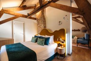 a bedroom with a large bed in a room at Château St Gerlach - Oostwegel Collection, member of Relais and Châteaux in Valkenburg +27 photos