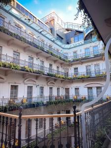 a building with balconies and plants on it at Aria Hotel Budapest by Library Hotel Collection in Budapest