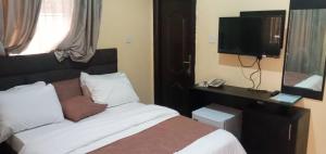 Postel nebo postele na pokoji v ubytování Benji Apartments