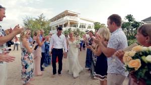 a bride and groom walking down the aisle at their wedding at Seri Resort Gili Meno - Adults Only in Gili Meno +207 photos