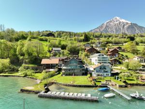 an aerial view of a town on the water at Bijou Studio with Ambiance near Lake in Faulensee