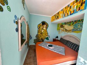 Postel nebo postele na pokoji v ubytování Hostel Los Duendes del Sur
