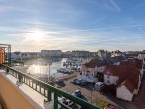 a view of a harbor with boats in the water at Apartment La Presqu'île-7 by Interhome in Cabourg