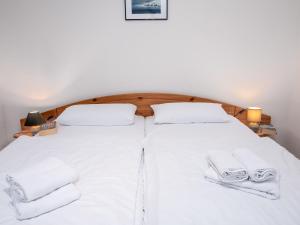 Ένα ή περισσότερα κρεβάτια σε δωμάτιο στο Holiday Home Albatross by Interhome