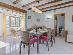 a dining room and living room with a table and chairs at Holiday Home La Concha by Interhome in Balcon del Mar