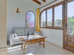 a living room with a couch and a table at Holiday Home La Concha by Interhome in Balcon del Mar