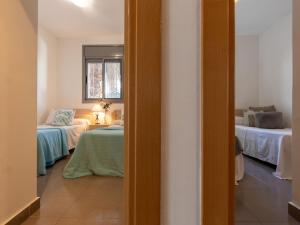 Posteľ alebo postele v izbe v ubytovaní Holiday Home Gaviota 11 by Interhome