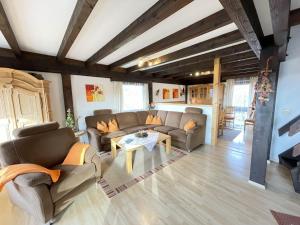a living room with couches and a coffee table at Holiday Home Ferienpark Vorauf-3 by Interhome in Molberting