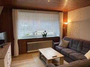 a living room with a couch and a table at Apartment Söhle by Interhome in Neuenkirchen