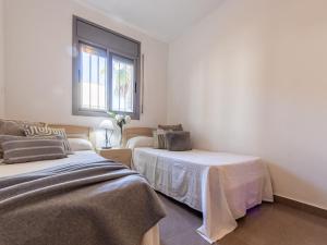 Posteľ alebo postele v izbe v ubytovaní Holiday Home Gaviota 7 by Interhome