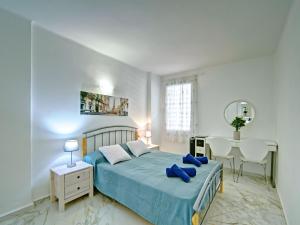 a bedroom with a bed and a table and chairs at Apartment L'Ancora by Interhome in Jávea