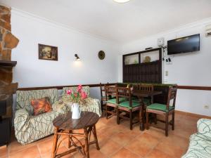 a living room with a couch and a table at Apartment Adelfa apt 6 by Interhome in Sant Martí d'Empúries