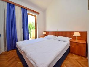 Posteľ alebo postele v izbe v ubytovaní Apartment Meridiana-4 by Interhome