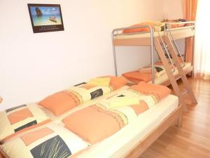 a bedroom with two bunk beds and a ladder at Apartment Hess Park by Interhome in Engelberg