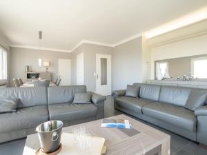 a living room with a couch and a table at Holiday Home Gisèle by Interhome in Saint-Aygulf +62 photos