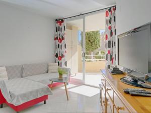 a living room with a couch and a tv at Apartment Apolo VII-2 by Interhome in Calpe