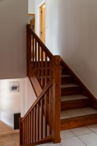 a staircase with wooden railings in a house at Chalet des bois de Criou in Morillon