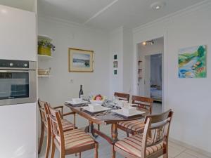 a kitchen and dining room with a table and chairs at Apartment Galicia Javea-2 by Interhome in Jávea