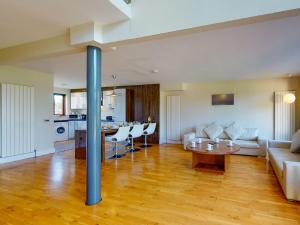 a living room with a couch and a table at Holiday Home Castlemartyr Holiday Lodge by Interhome in Cork