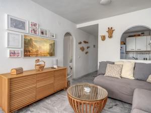 a living room with a couch and a table at Apartment Angel Blanco by Interhome in La Cala de Mijas +27 photos
