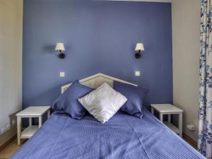 a blue bedroom with a bed with blue walls at Apartment Les Rivages de Coudoulière-10 by Interhome in Six-Fours-les-Plages