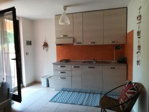 a kitchen with a sink and a counter top at Lido I Palmizi in Capoliveri